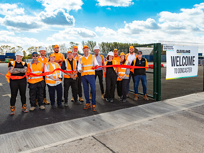 Cleveland Group in high viz jackets cutting the ribbon to their new depot in Doncaster.