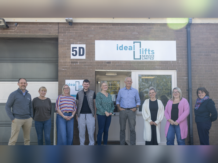 Image of Ideal Lifts Service Team stood outside of their office.